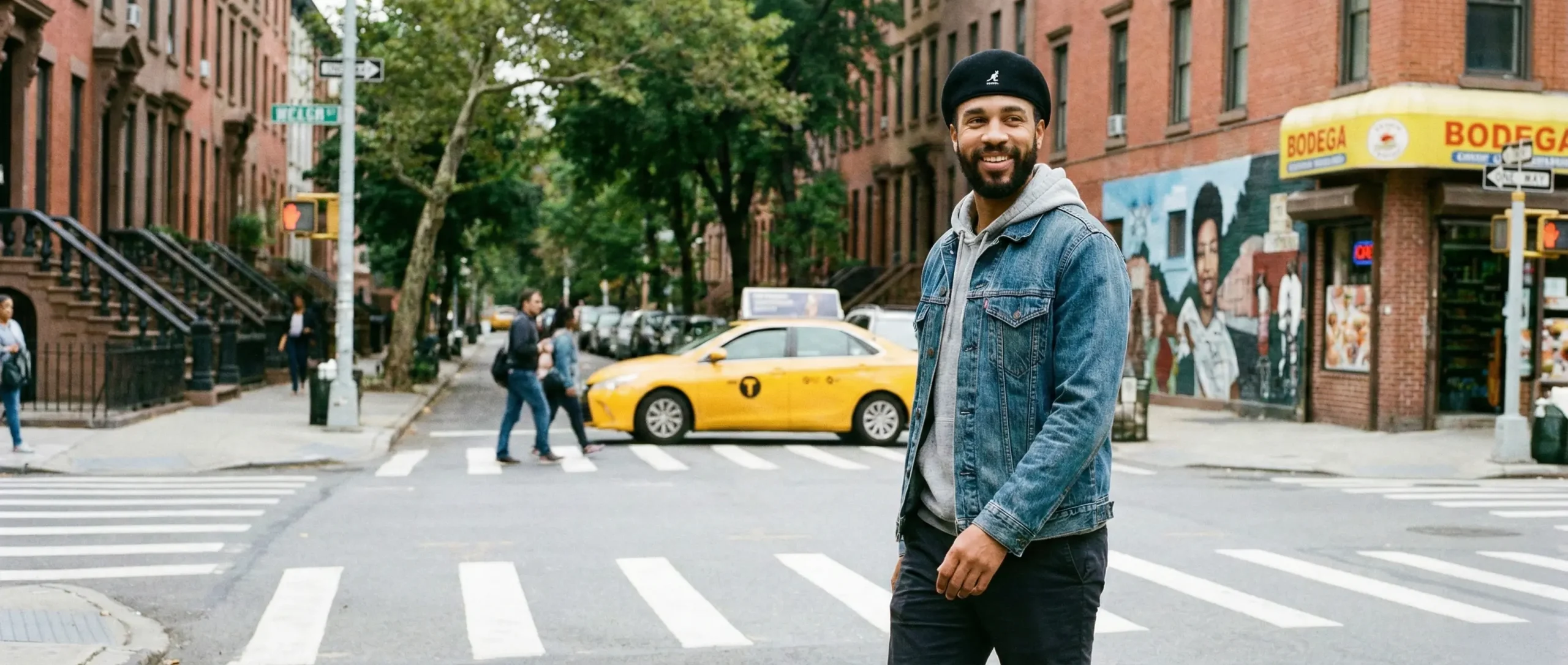 man wearing a kangol cap in the streets.