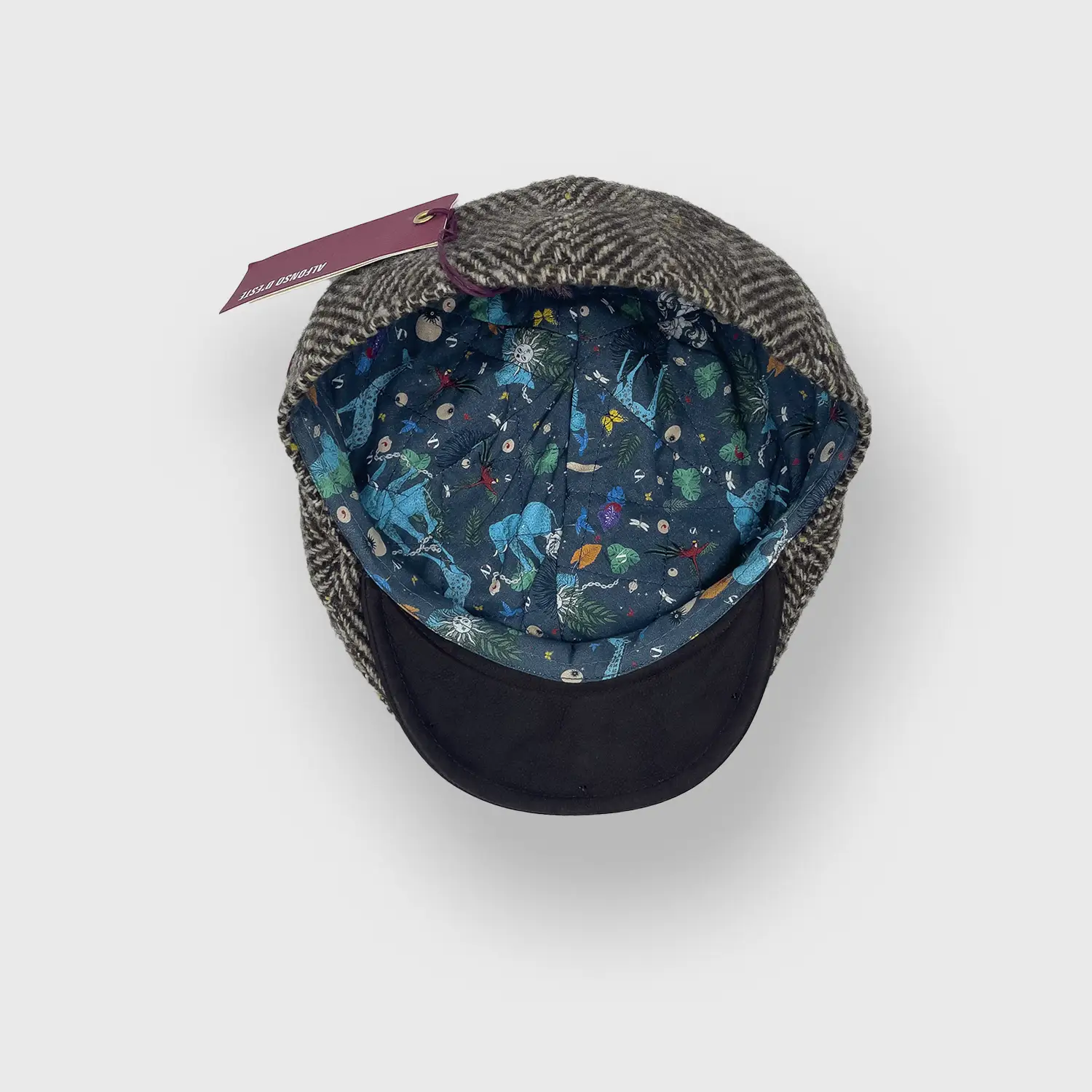 The barber 6 panel pet in tweed met visgraat patroon Alfosno D'este binnenkant.