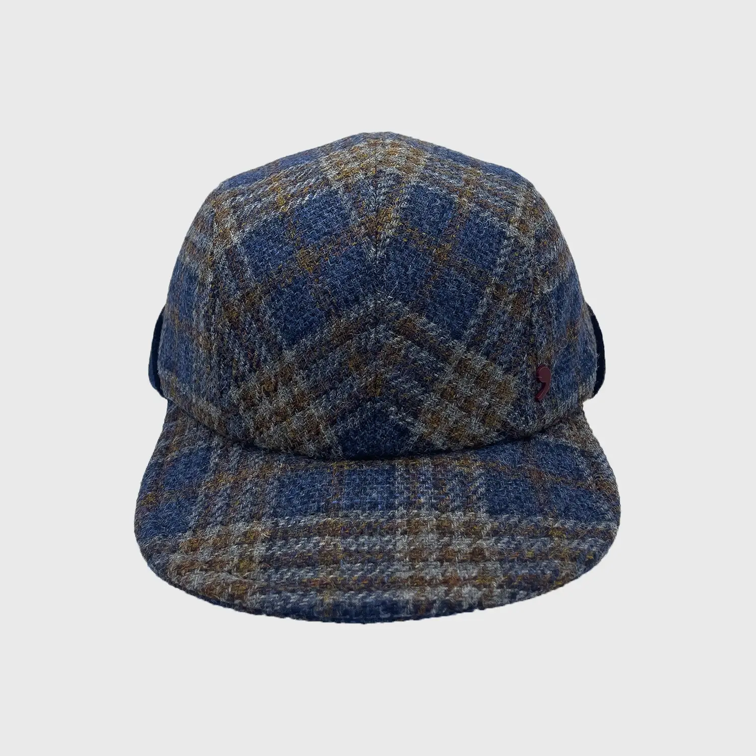 Pet in tweed met patroon voorkant.