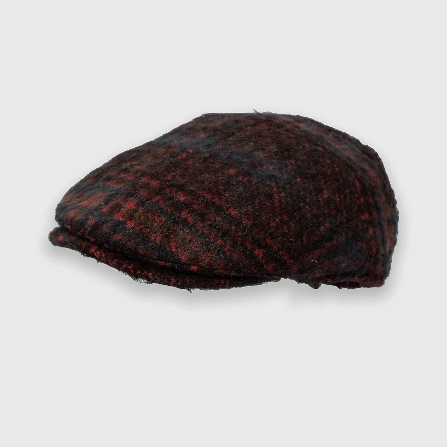Rugged wool cap in burgundy red with a stripe pattern, tilted