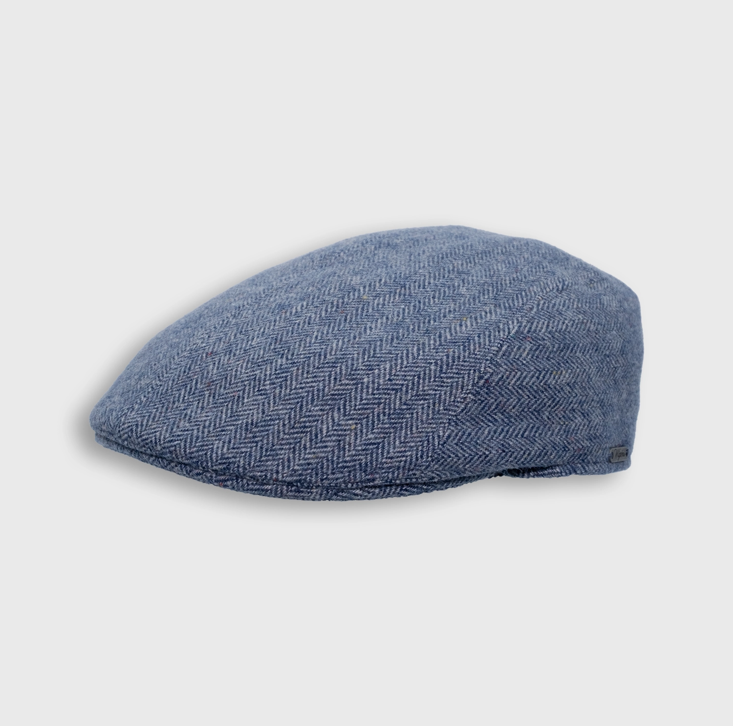 The driver in blue gray herringbone, tilted profile, by Wigéns