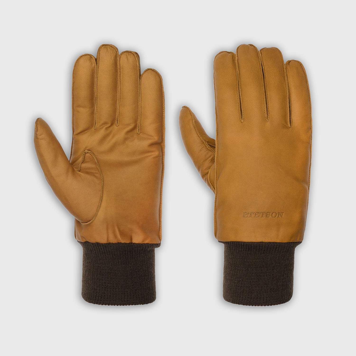 "Gants homme Stetson en cuir lisse jaune ocre, poignet tricoté brun foncé et logo en relief."